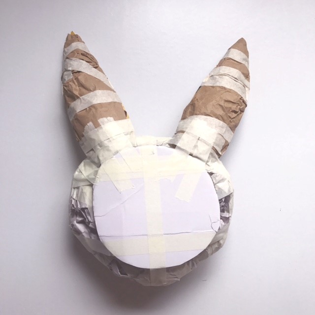 Attach ears, animal head paper mache